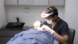 Dermatologist conducting skin treatment in modern clinic